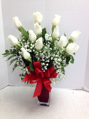 white roses red vase