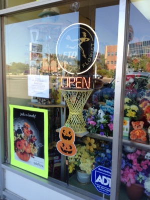 <img src="image.gif" alt="The Flower Shop at Halloween" />