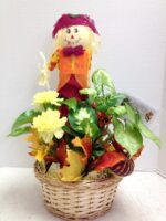 fall planter with scarecrow