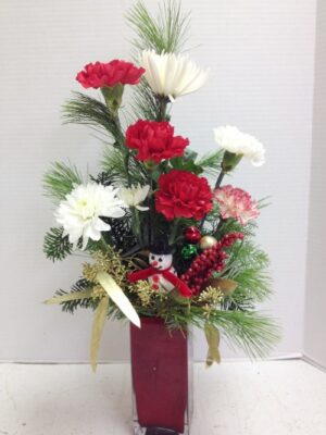 tall red vase flowers with snowman