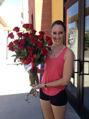 Dozen red roses Happy Women Customer