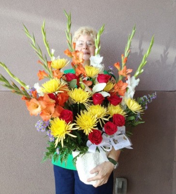Pamela holds Funeral Flowers