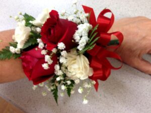 white corsage and boutonniere for prom