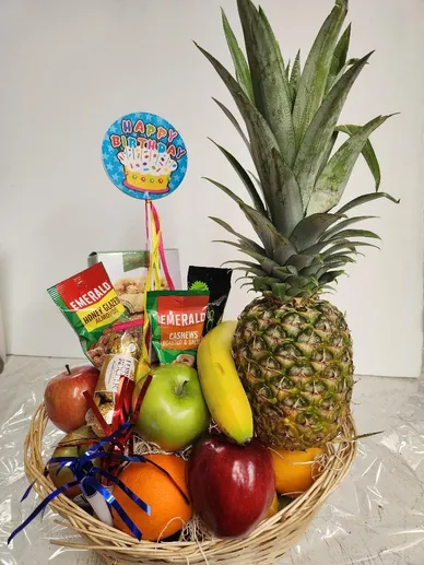 Healthy birthday gift basket with fruit and birthday topper
